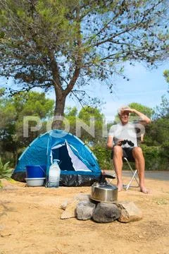 Man alone with tent for adventure camping Stock Photos
