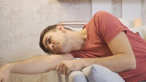 The man is alone, thoughtful and bored. Stock Footage 218906505