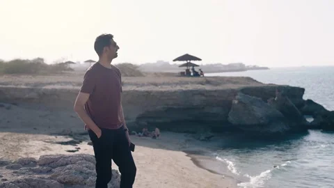 Man along the beach during the day Stock Footage 307587297