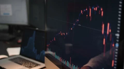 Man analysing stock market changes in home office, computer display with graphs Stock Footage 144601944