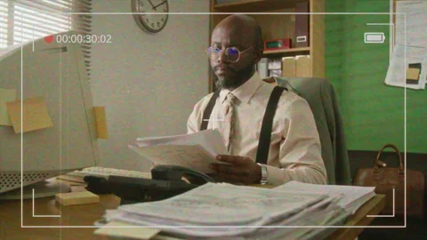 Man Analyzing Documents in Retro Office VHS Style Видео 341417226