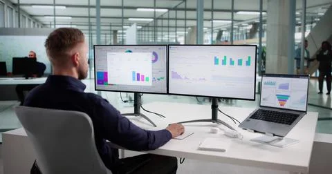 Man Analyzing Market Data On Performance Dashboard For Predictive Business Stock Photos