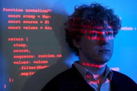 Man Analyzing Projected Cybersecurity Code in Modern Office Stock Photos