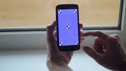Man and a blue screen smartphone Video stock 72935520