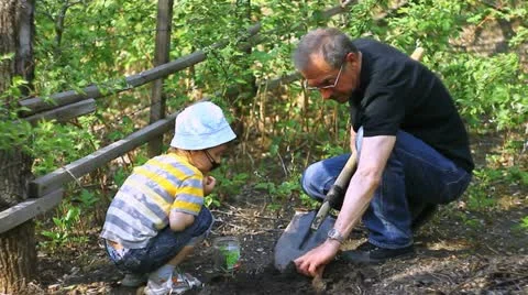 Man and boy in garden Video stock 10945120