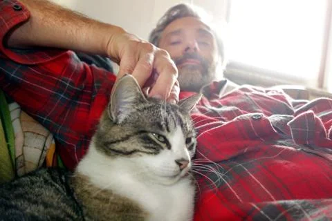 Man and cat Stock Photos