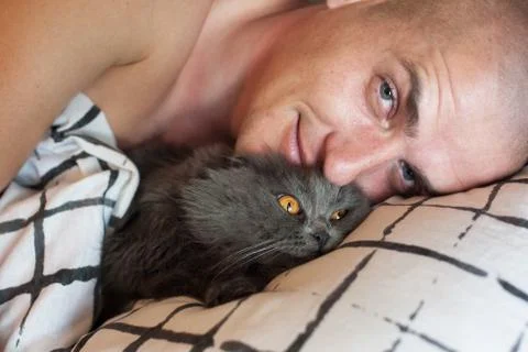 Man and cat Stock Photos