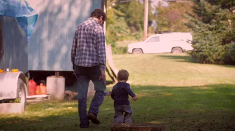 Man and child holding hands and walking Stock Video Pond5