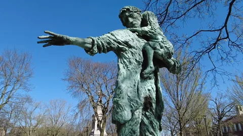 MAN AND CHILD STATUE Stock Footage 194834114
