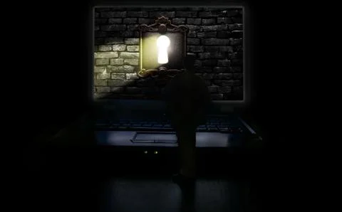 Man and computer keyhole light Stock Photos