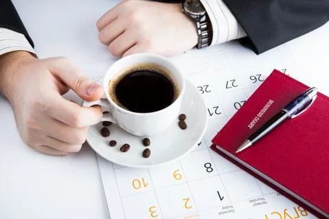 Man and cup of coffee in the workplace 库存照片