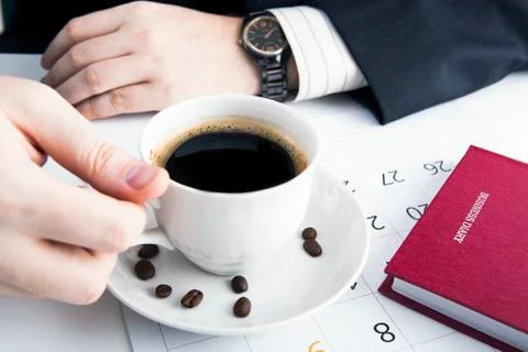 Man and cup of coffee in the workplace Stock-Fotos