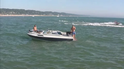 Man and Dog, Both Dive off Boat into Lake Michigan Part #3 Video stock 11202314