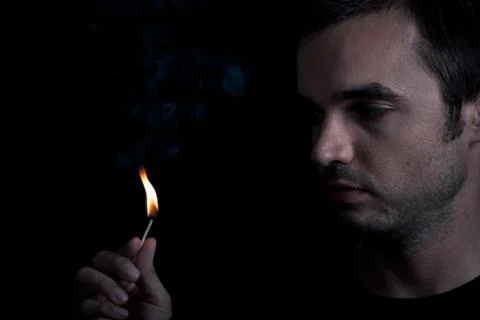 Man and fire Stock Photos