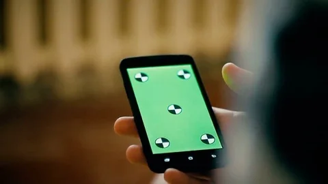 Man and a green screen smartphone Stock Footage 69213664