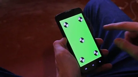 Man and a green screen smartphone Видео 69213928