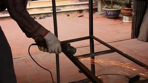 Man and grinder Stock Footage 72968632