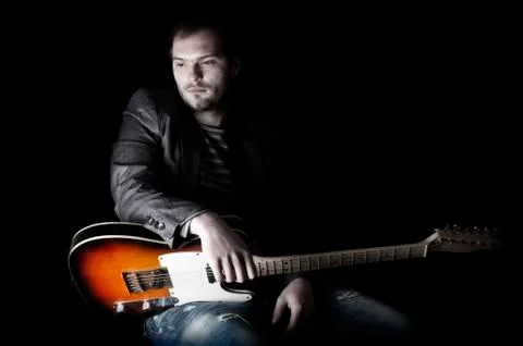 Man and guitar Stock Photos