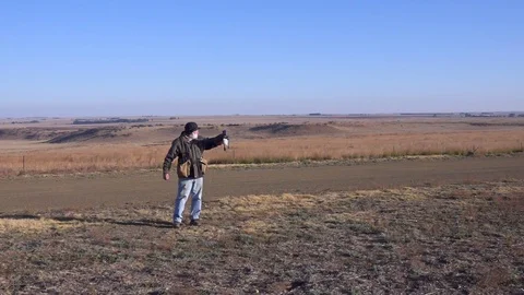 Man and Hawk Eagle train in arid grassland shot in slow motion Stock-Footage 104061830