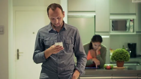 Man and his girlfriend using modern technology in the kitchen Stock-Footage 43242404
