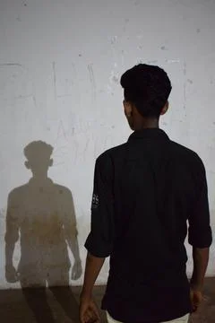 A man and his shadow Stock Photos