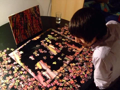 Man and Jigsaw Stock Photos