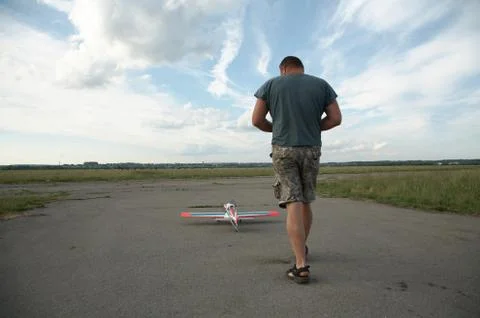 Man and model of the plane Stock Photos