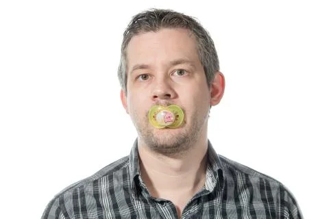 Man and a pacifier Stock Photos