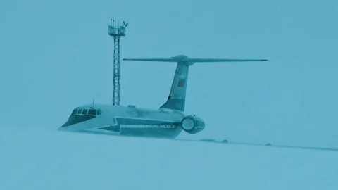 Man and plane in the snow Stock Footage 125948082