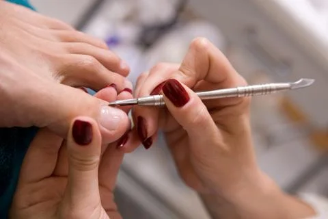 Man and  the procedure of pedicure Stock Photos