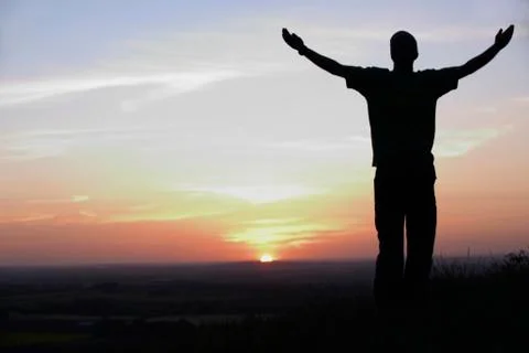 Man and sunset Stock Photos