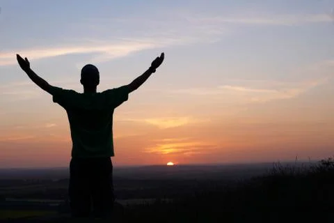 Man and sunset Stock Photos