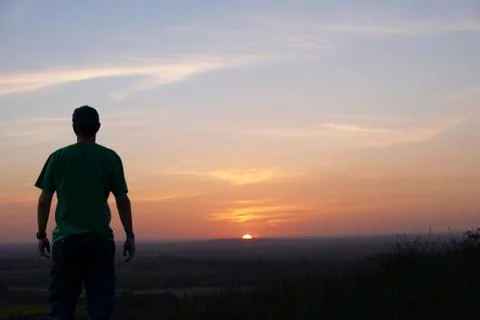 Man and sunset Stock Photos