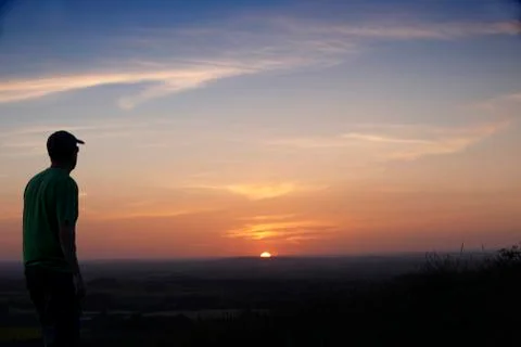 Man and sunset Foto stock