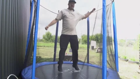 A man and a trampoline 4K Stock Footage 320866339