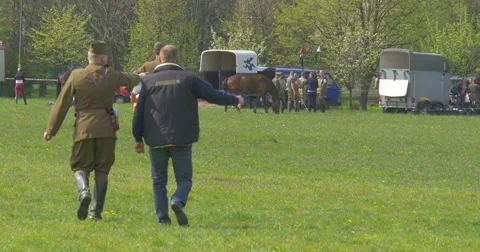 Man and Two Men in Uniform During the Preparation of the National Holiday. Stock Footage 62794532