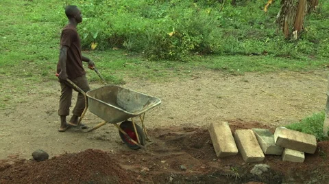 MAN AND WHEELBARROW Stock Footage 57983200
