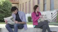 a man and a woman are reading on newspaper HD Footage