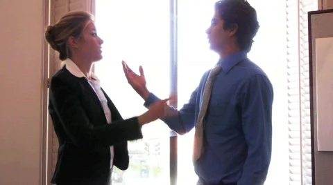 Man and Woman in Business Attire Argue, Fight, Throw Punch Stock Footage