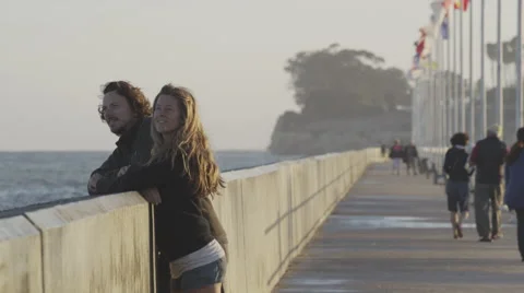 Man and Woman Couple Walk Down Pier Boardwalk 4K Stock Video Footage Stock Footage