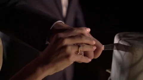 Man and woman cutting celebration cake Stock Footage