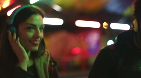 Man and woman dancing to the rhythm of music with headphones Stock Footage 59556077