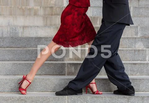 Man And Woman Dancing Tango On Street Staircase