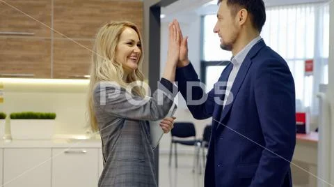 Man and a woman discuss important issues of the forthcoming work Stock Photos