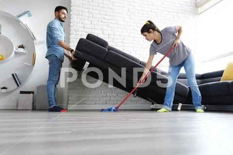 Man And Woman Doing Chores Cleaning Floor Stock Photos