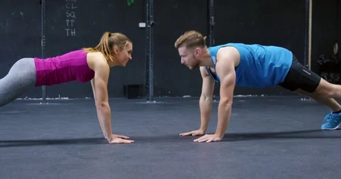 Man And Woman Doing Pushups With High-fives Stock Footage 75038962