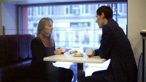 Man and woman drinking tea in the cafe Stock Footage 70284577