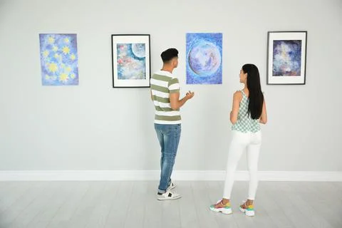 Man and woman at exhibition in art gallery Stock Photos