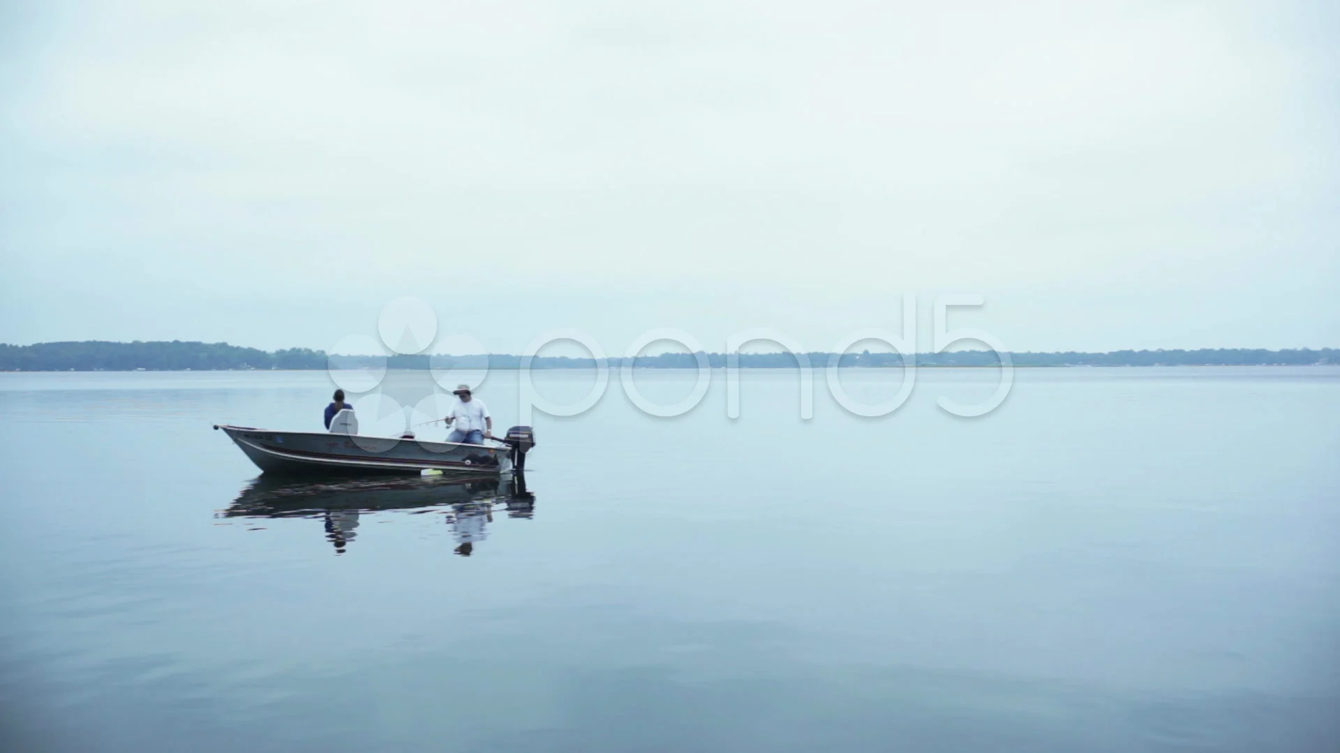 Man and woman fishing in boat on a lake., Stock Video