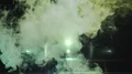 The man and woman going in the night street through the smoke cloud. slow motion 4k or 4k+ Resolution